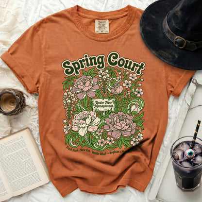 Orange t-shirt with "Spring Court" and floral design.