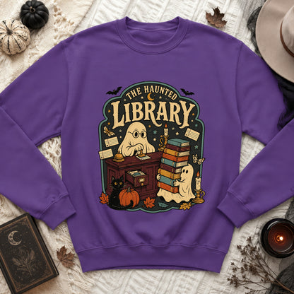 Purple sweatshirt with "The Haunted Library" graphic featuring ghosts and a black cat.