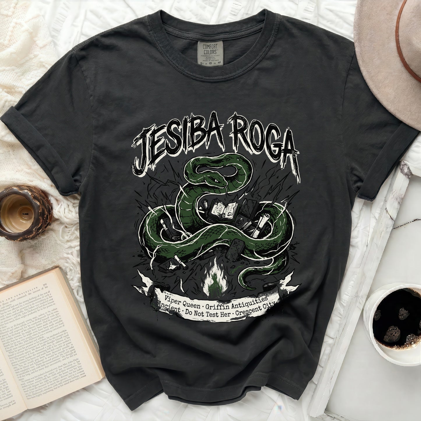 Black t-shirt with green serpent and text "JESIBA ROGA Viper Queen Griffin Antiquities"