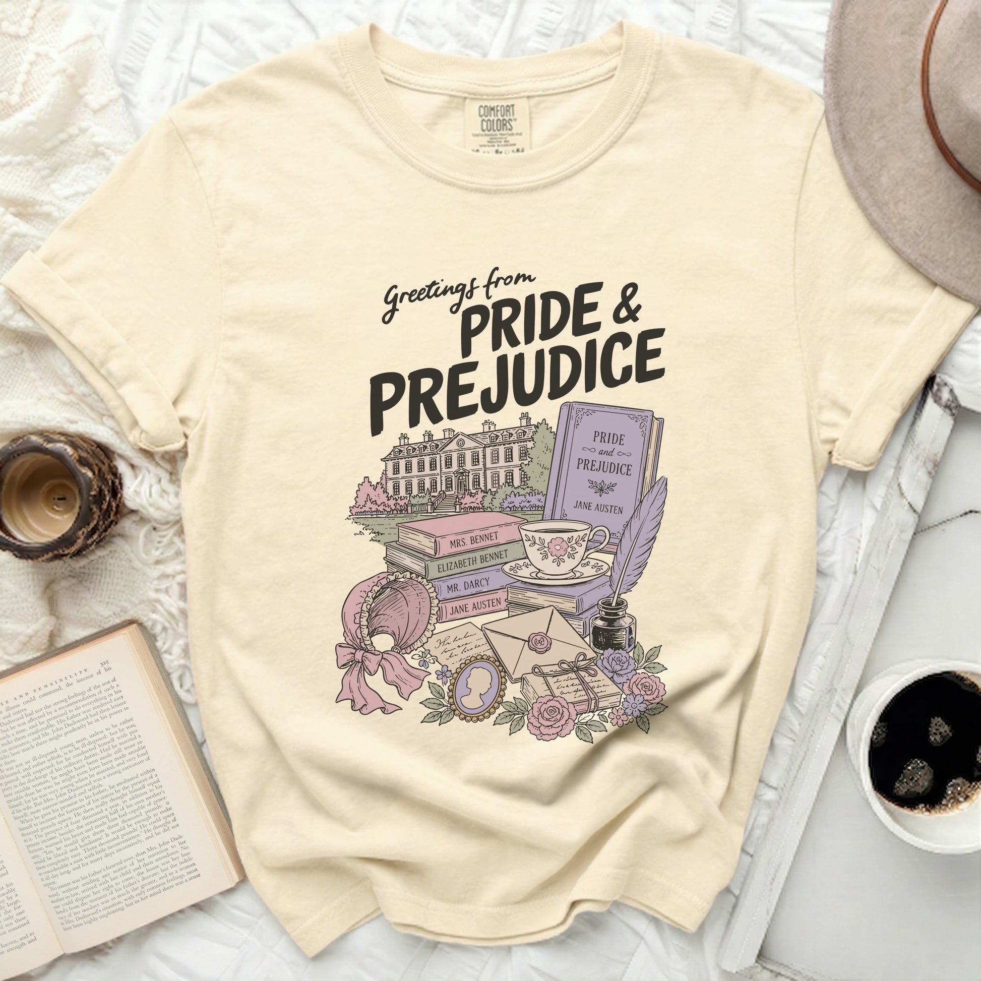 Cream t-shirt with "Pride & Prejudice" themed illustration.