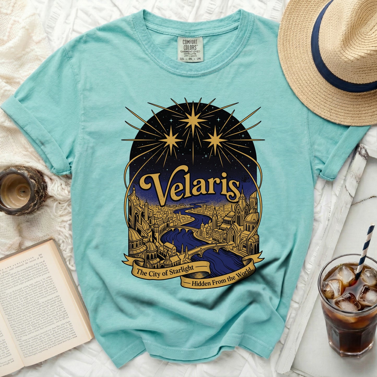 Turquoise t-shirt with "Velaris, The City of Starlight" design.