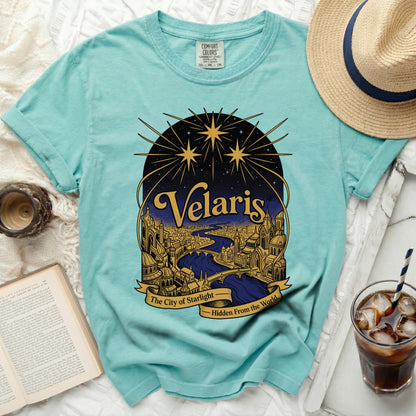 Turquoise t-shirt with "Velaris, The City of Starlight" design.