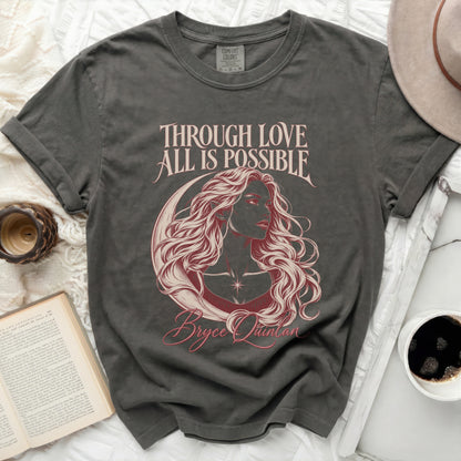 Dark grey t-shirt with text "THROUGH LOVE ALL IS POSSIBLE" and an illustration of Bryce Quinlan.