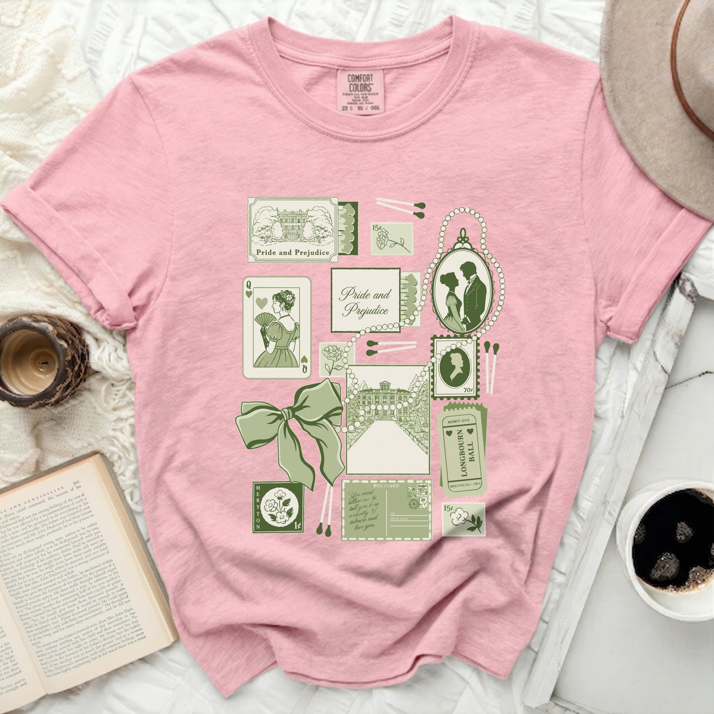 Pink t-shirt with vintage-style "Pride and Prejudice" motifs and text.
