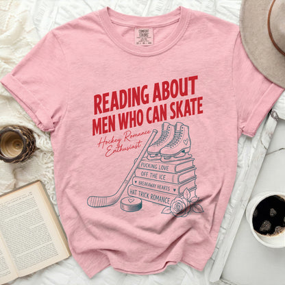 T-shirt with "Reading About Men Who Can Skate" text and hockey graphics.