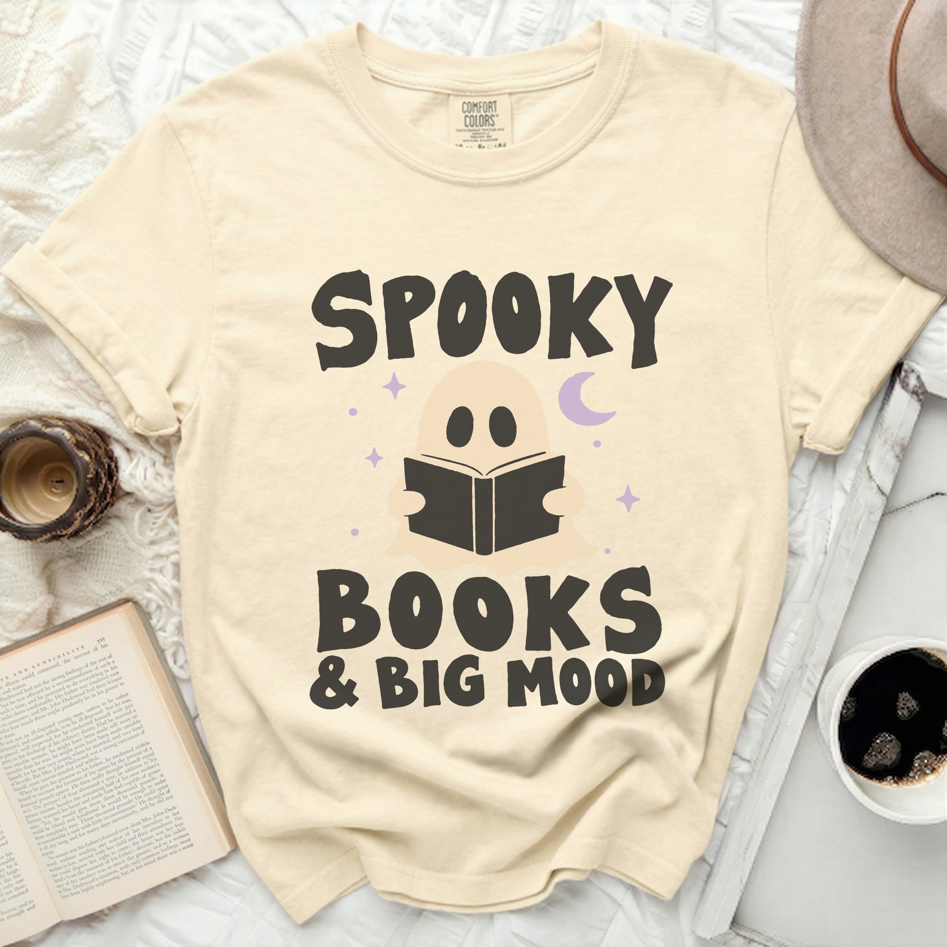 Cream t-shirt with "Spooky Books & Big Mood" text and ghost graphic.
