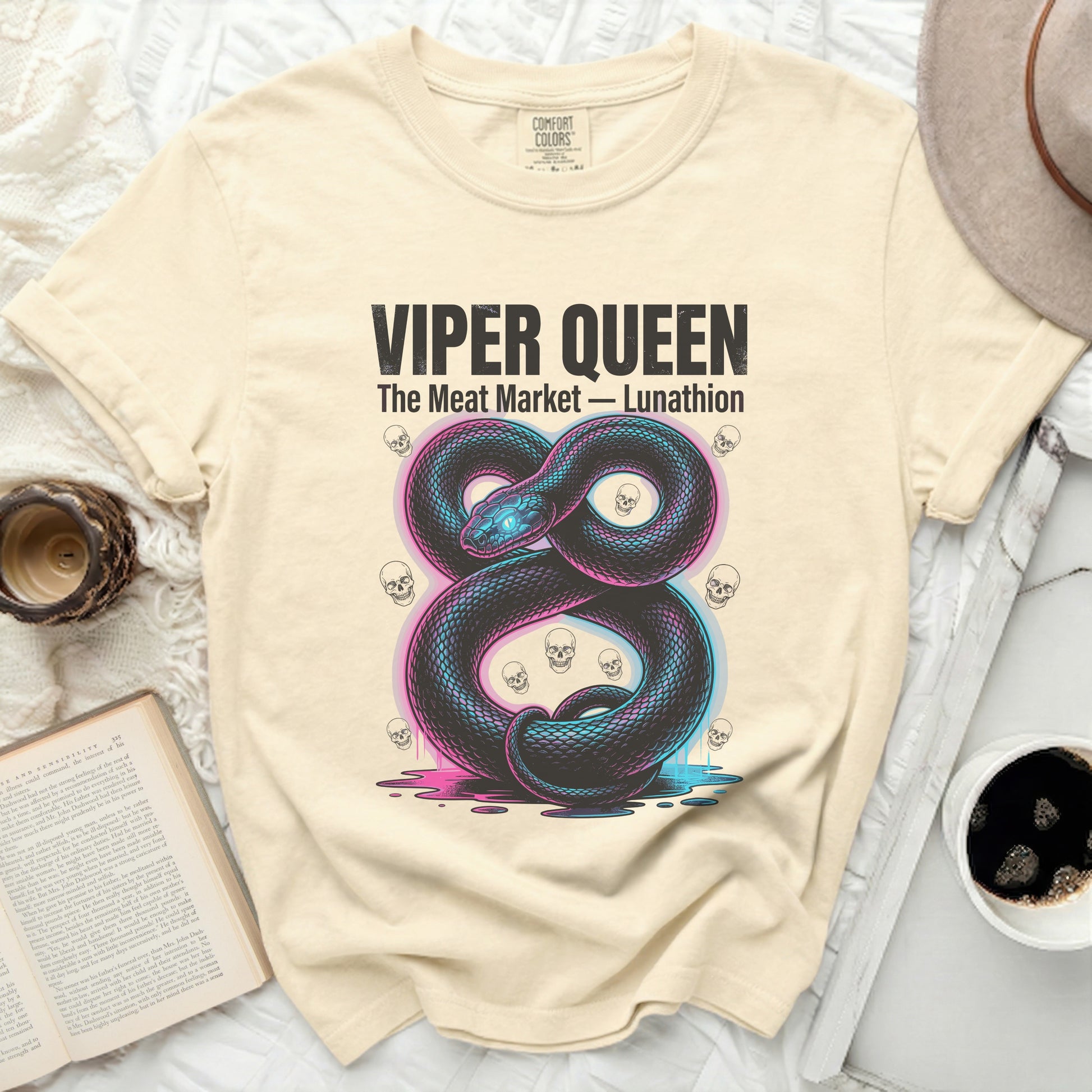 Cream t-shirt with black viper, skulls, and "Viper Queen The Meat Market - Lunathion" text.