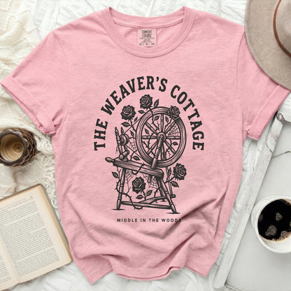 Pink t-shirt with "The Weaver's Cottage Middle in the Woods" graphic.
