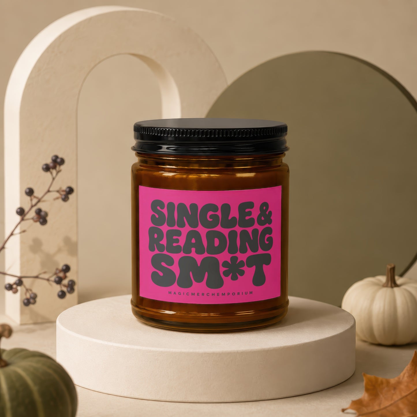 Amber candle with pink label reading "Single & Reading Sm*t".