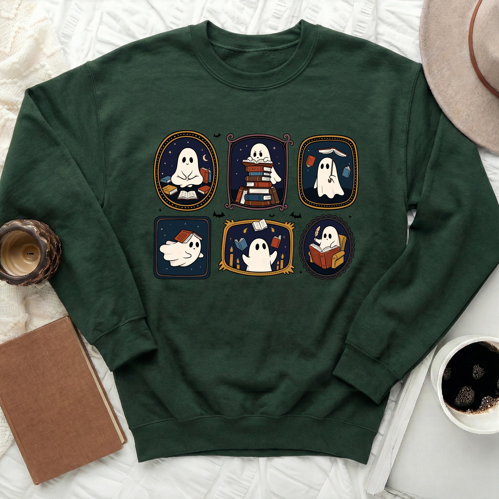 Dark green sweatshirt with six framed illustrations of ghosts reading books.