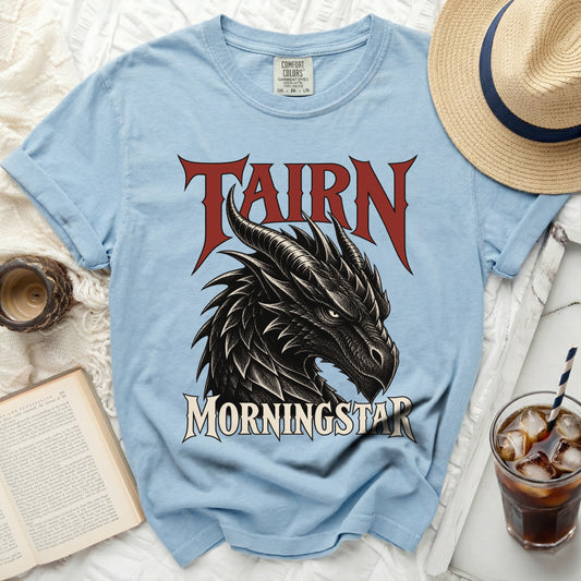 Light blue t-shirt with a black dragon graphic and text "TAIRN MORNINGSTAR".