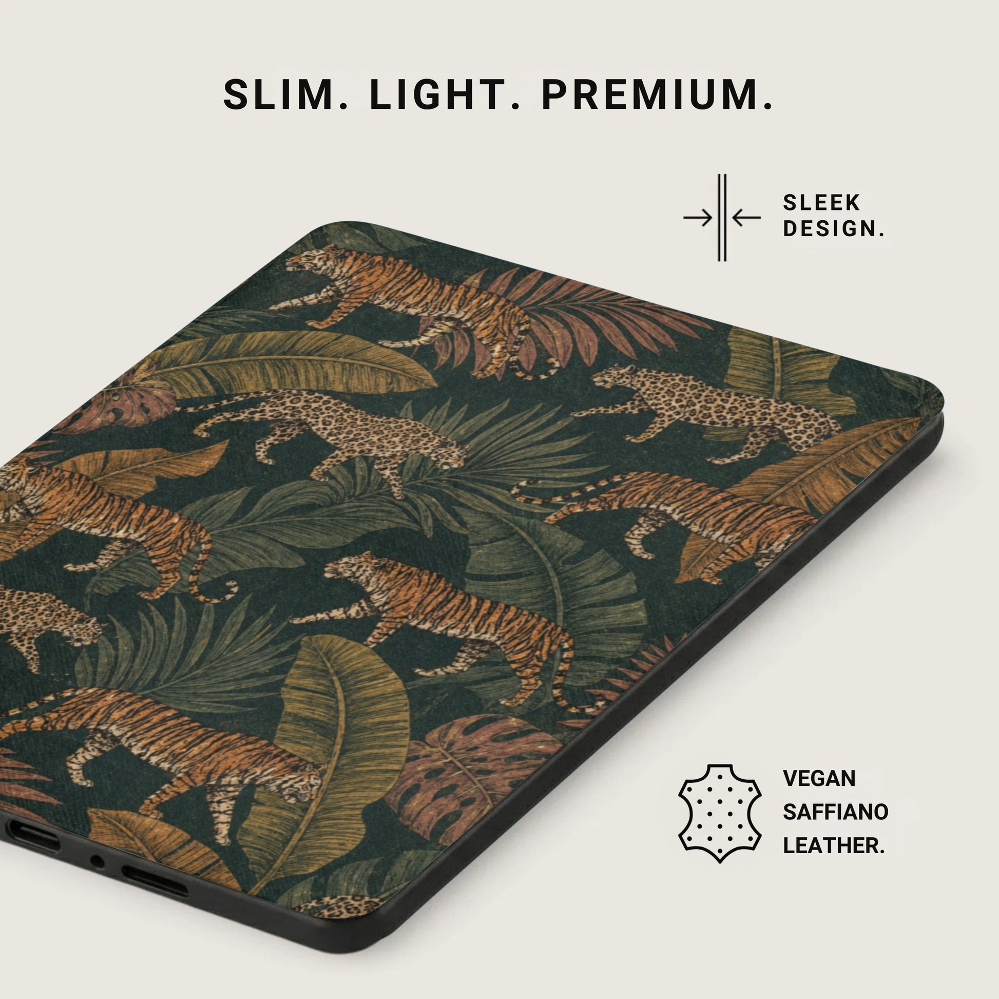 Phone case with tiger and leopard print, jungle leaves, and vegan saffiano leather label.