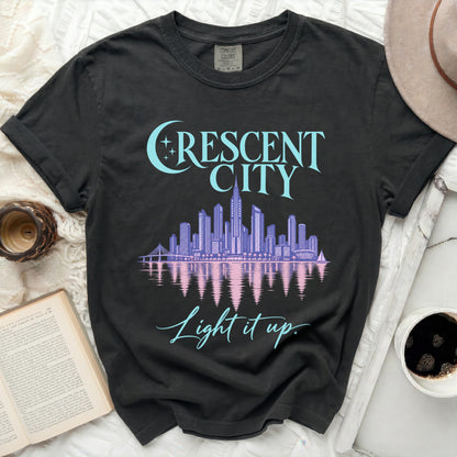 Black t-shirt with "Crescent City" skyline graphic and "Light it up." text.