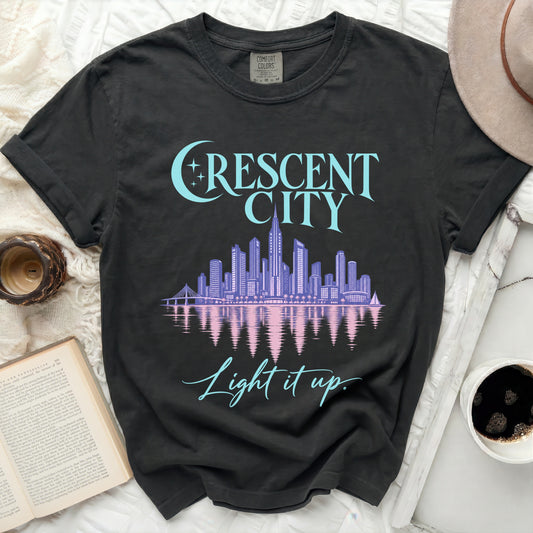 Black t-shirt with "Crescent City" skyline graphic and "Light it up." text.