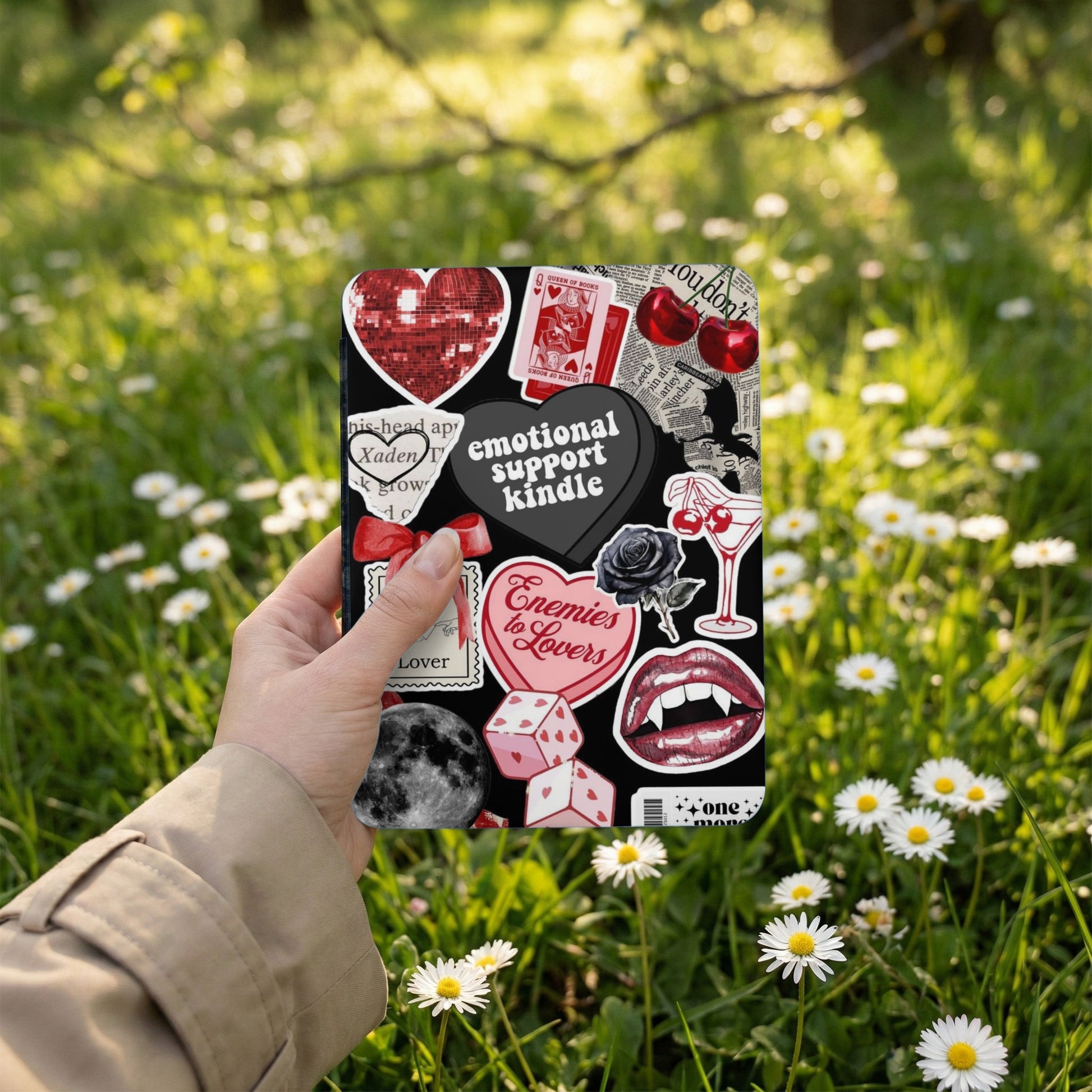 Black Kindle case with collage of dark aesthetic stickers and text.