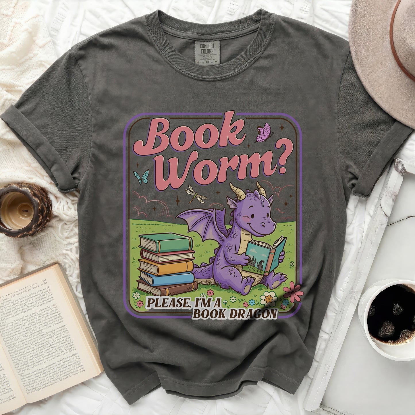 Grey t-shirt featuring a graphic with a purple dragon reading a book, text "Book Worm? Please, I'm a BOOK DRAGON".