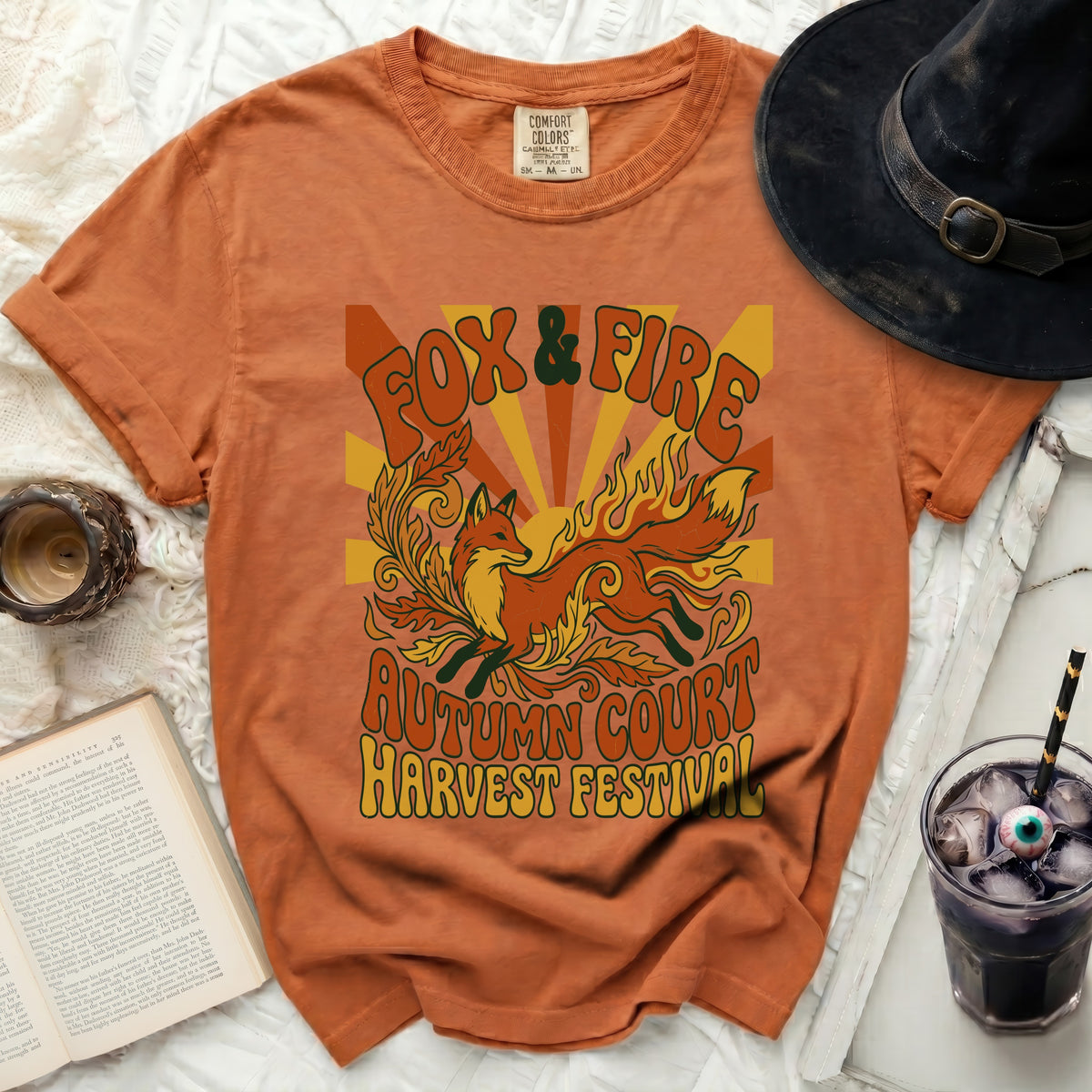 Orange t-shirt with "Fox & Fire Autumn Court Harvest Festival" graphic.