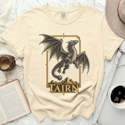 Cream t-shirt with a black dragon and mountains graphic, text "TAIRN".