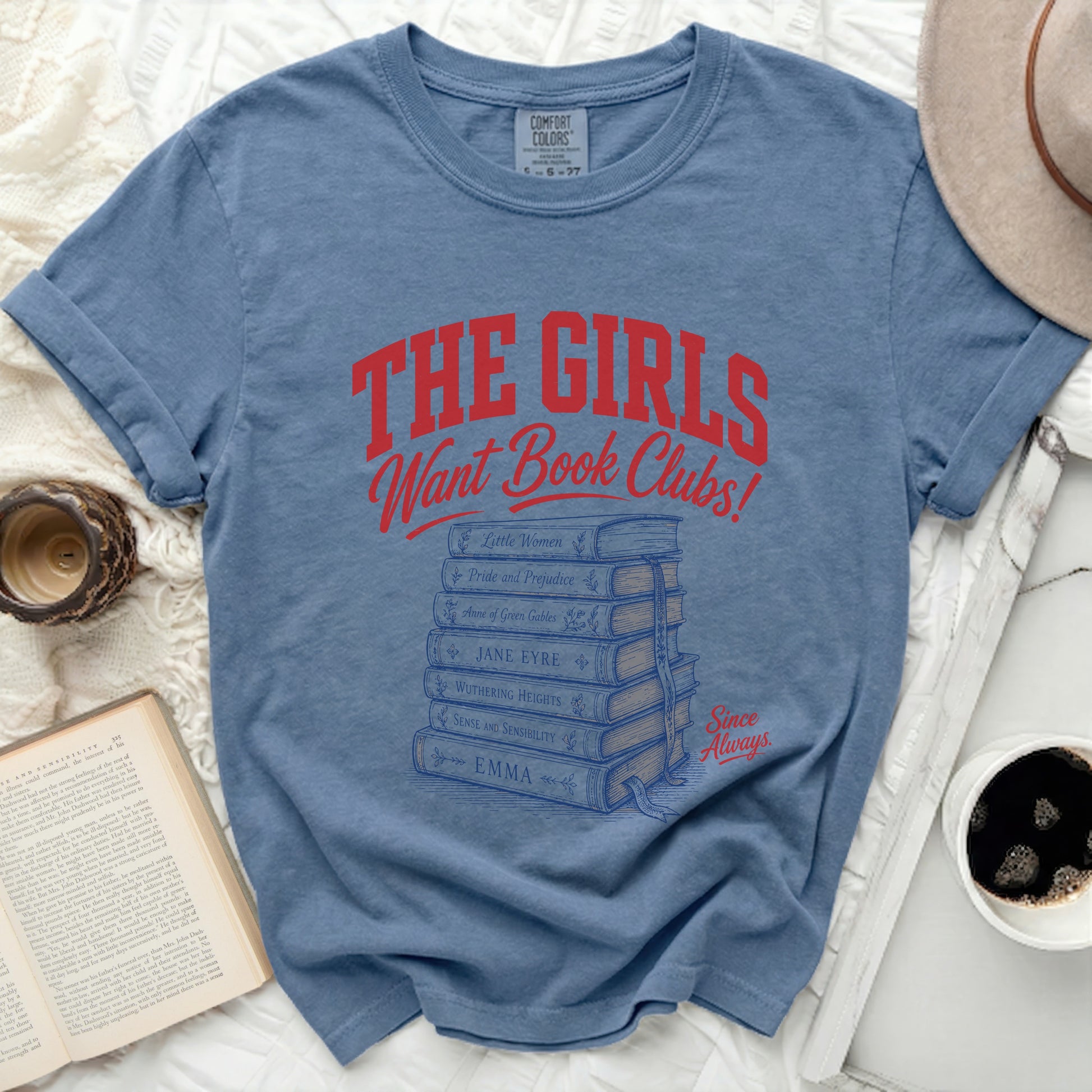 Blue t-shirt with "THE GIRLS Want Book Clubs!" and stacked book titles.