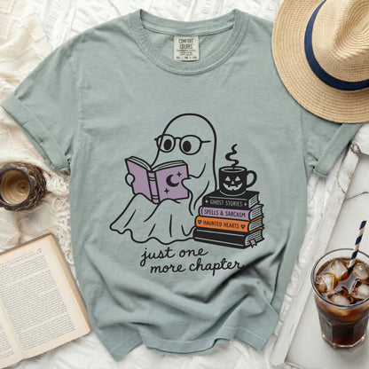 Ghost reading a book next to books and coffee, "just one more chapter."