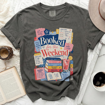 Graphic t-shirt with "Booked for the Weekend" and book-themed illustrations.