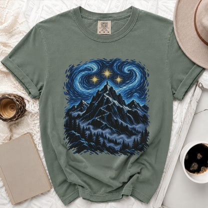 Green t-shirt with starry night mountain print and Comfort Colors tag.