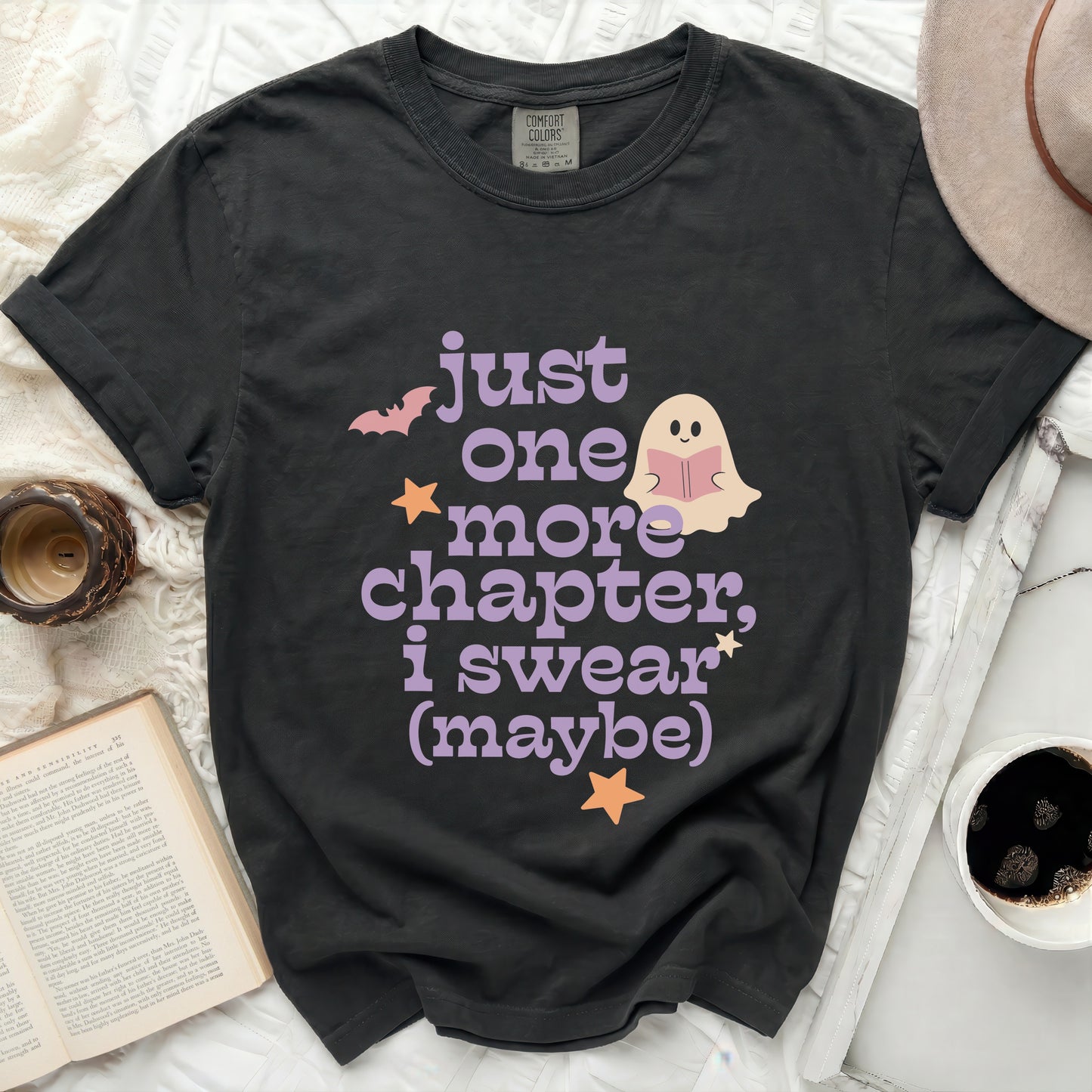 Black t-shirt with "just one more chapter, I swear (maybe)" text and graphics.