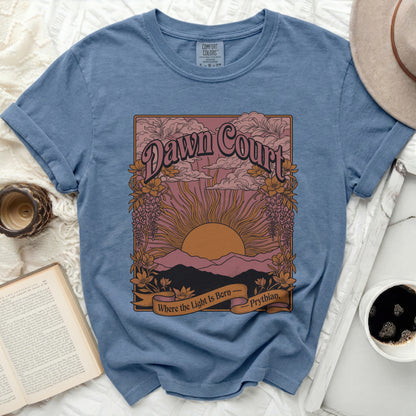 Blue t-shirt with "Dawn Court" graphic featuring a sunset over mountains.