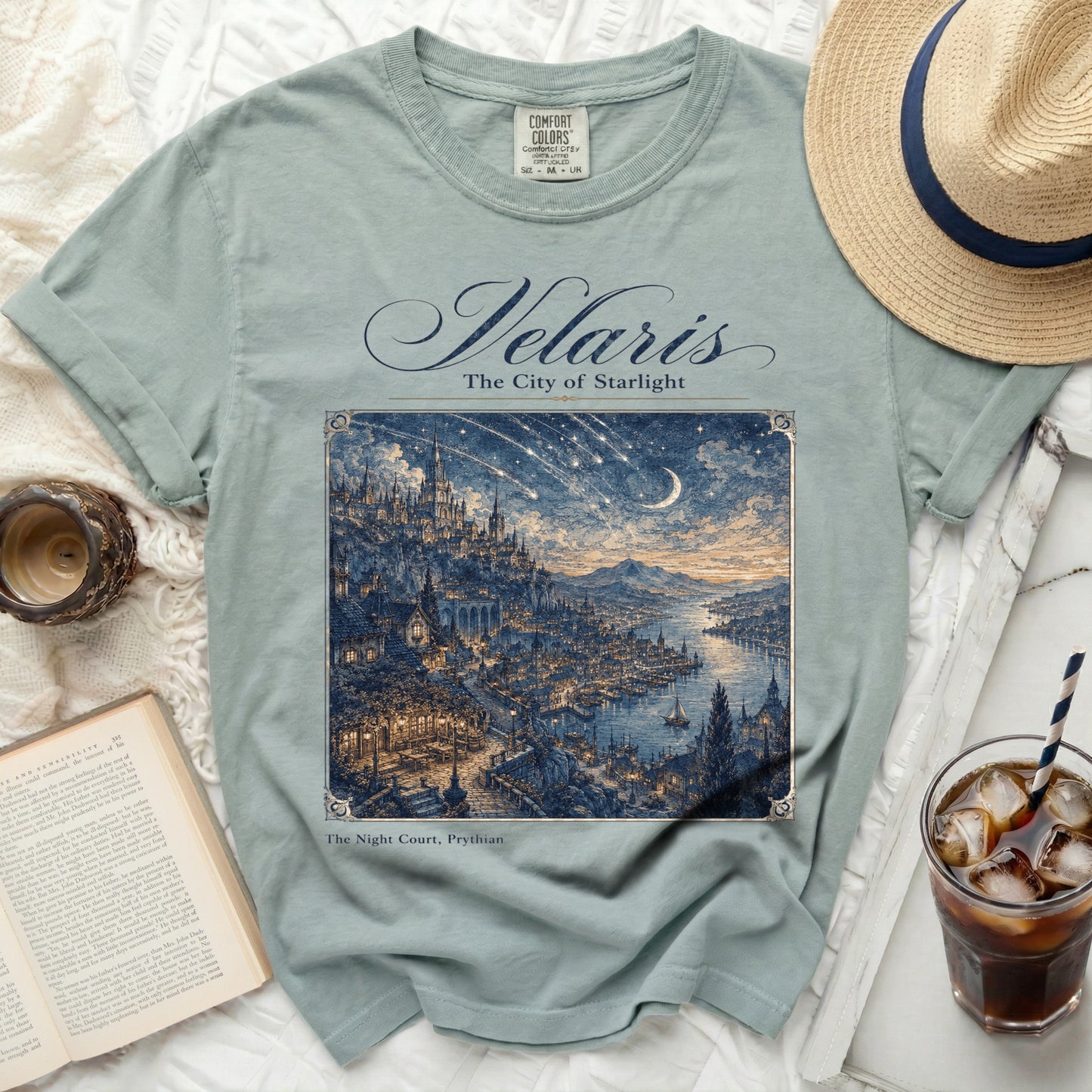 Light blue t-shirt with "Velaris The City of Starlight" and a nighttime city scene.