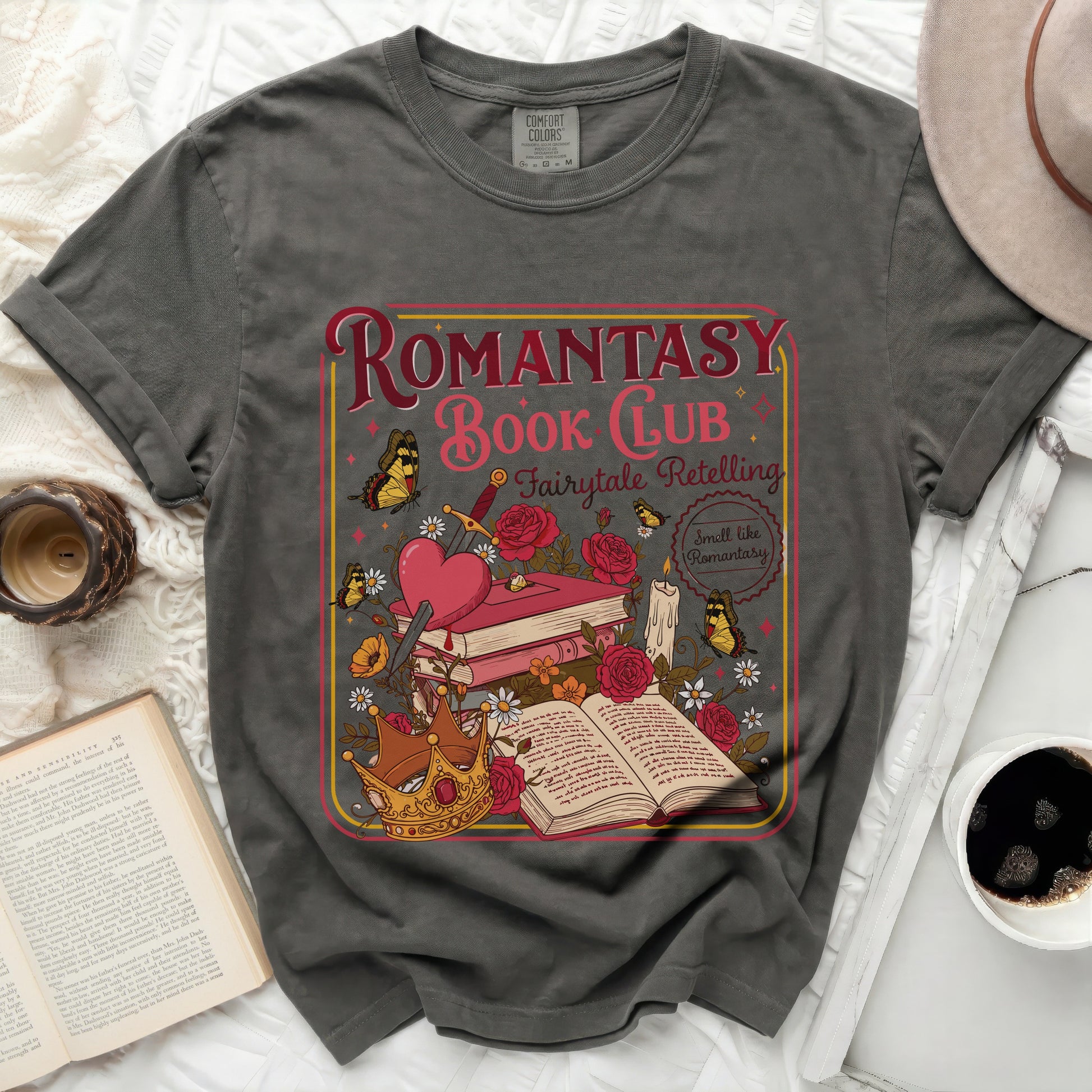 Romantasy Book Club graphic on a grey t-shirt with books, crown, sword, and butterflies.