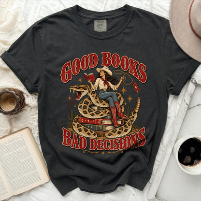 Dark gray t-shirt with a graphic of a woman on a snake, reading a book, with text "Good Books Bad Decisions".
