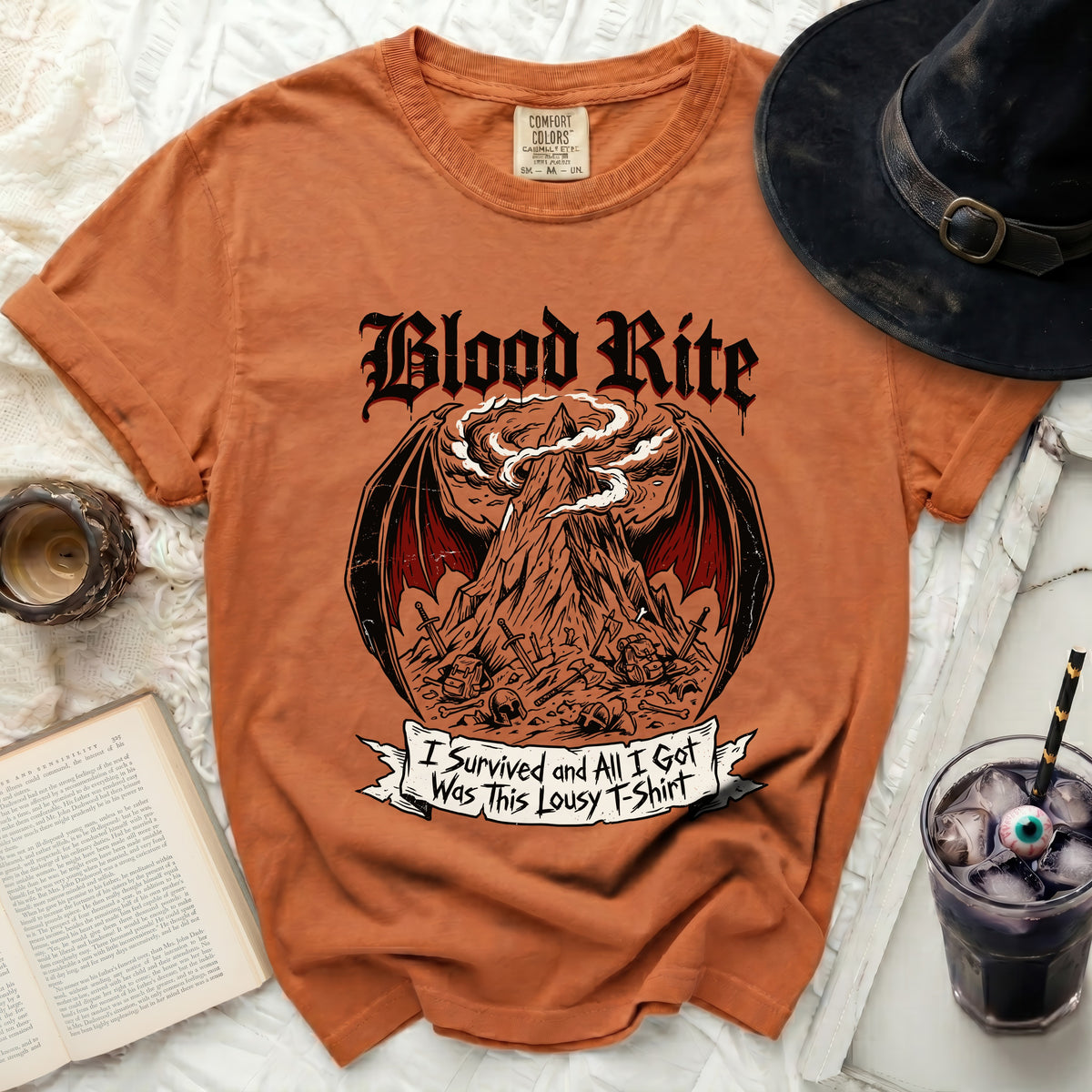 Orange t-shirt with "Blood Rite" and a mountain graphic, "I survived and all I got was this lousy t-shirt".
