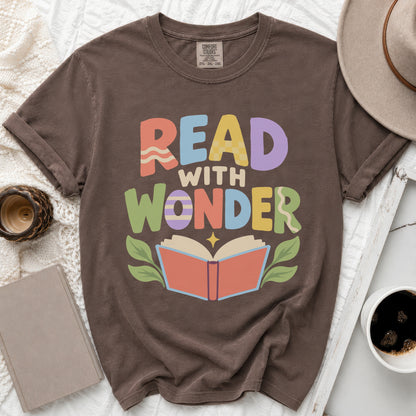 Brown t-shirt with "Read with Wonder" text and an open book graphic.