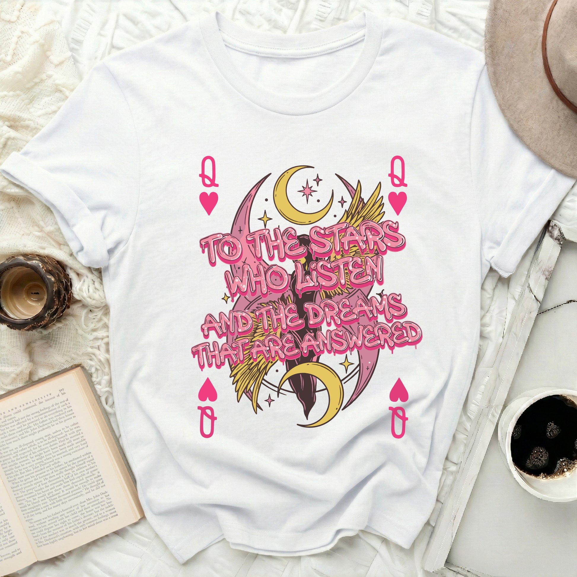 To The Stars Who Listen Dreams Answered Queen Hearts product type
Stars Who Listen, Dreams Answered, Queen Hearts, Playing Card Design, Celestial Moon, Winged Graphic, Fantasy Art, Inspirational Quote, Aesthetic Fashion, Graphic Print, Pink Gold Motif, Mystical Theme, Literary Quote, Spiritual Style, Cosmos Stars, Night Sky Artwork, Empowering Message, Trendy Apparel, Unique Design, Heart Symbolism