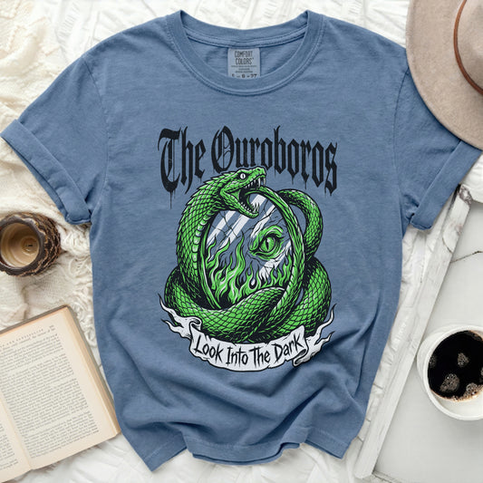 Blue t-shirt with Ouroboros snake and "Look Into The Dark" text.