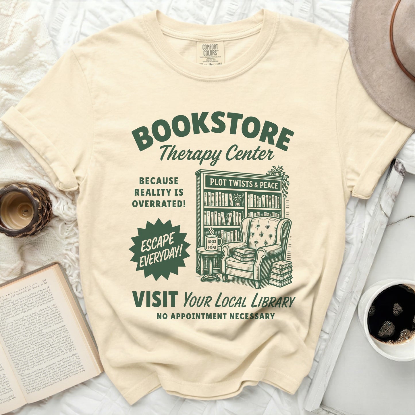 Bookstore Therapy Center t-shirt with library illustration and book-related text.