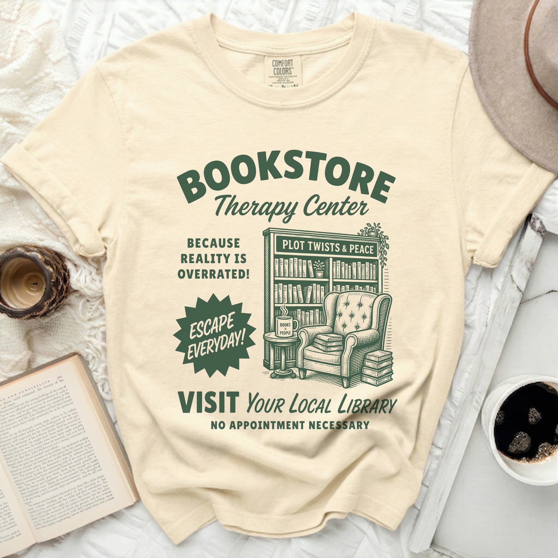 Bookstore Therapy Center t-shirt with library illustration and book-related text.