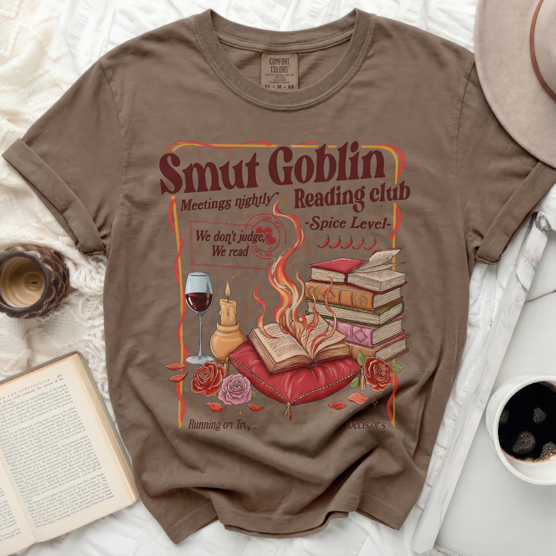 T-shirt with "Smut Goblin Reading Club" text and book-themed graphics.