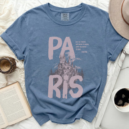 Blue t-shirt with "PARIS" and castle graphic with quote.