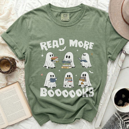 Green t-shirt with ghosts reading books and "READ MORE BOOOOKS" text.