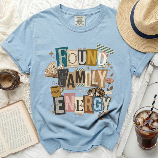 Found Family Energy text graphic on a light blue t-shirt.