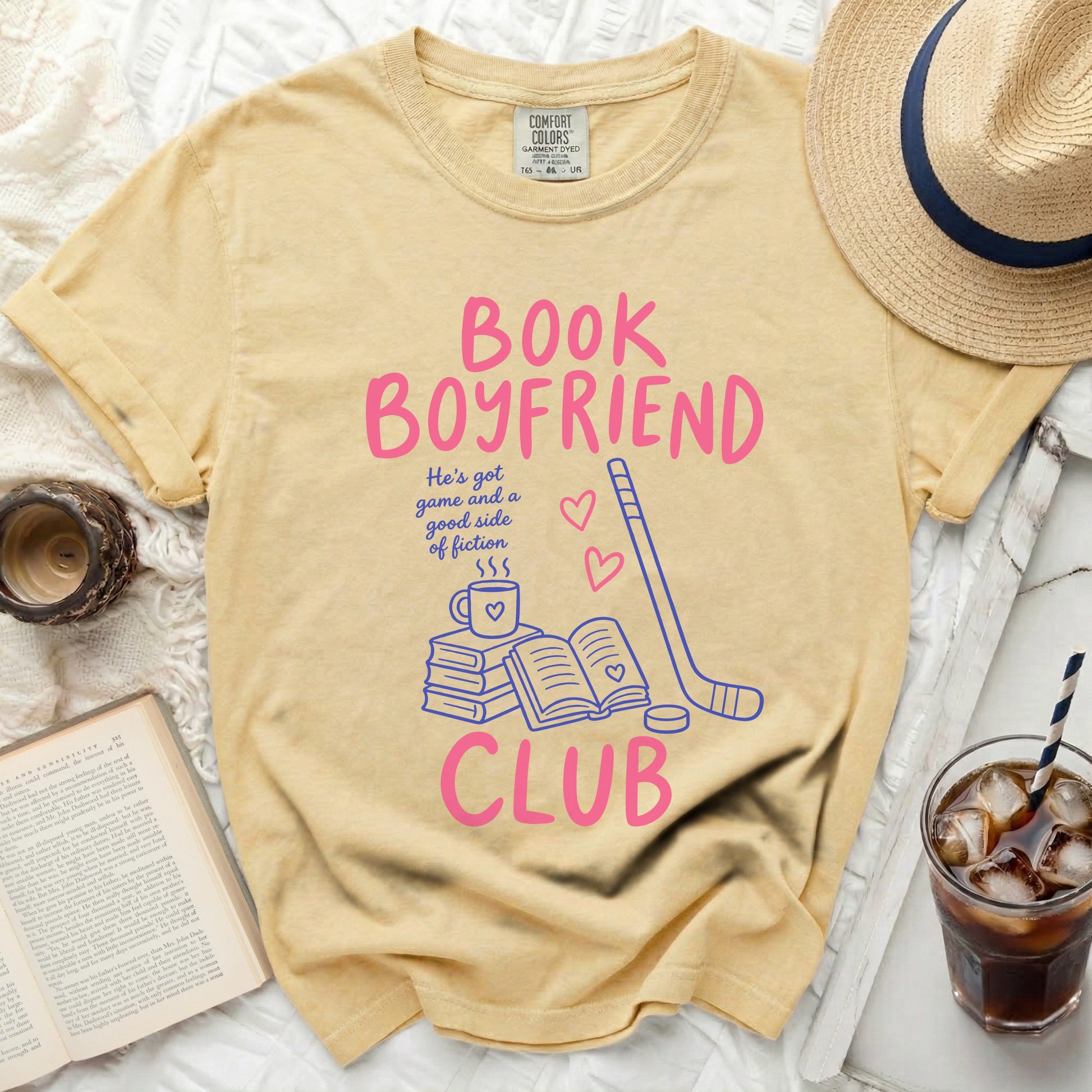 T-shirt with "Book Boyfriend Club" text, a book, and hockey stick.