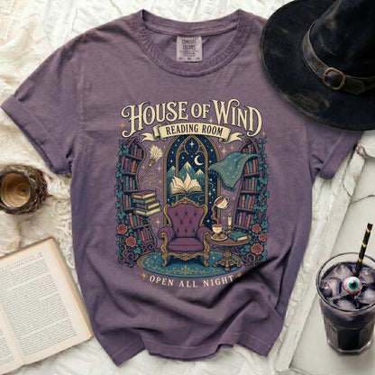 Purple t-shirt with "House of Wind Reading Room Open All Night" text and illustration.