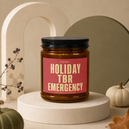 Amber candle jar with "Holiday TBR Emergency" text on a red label.