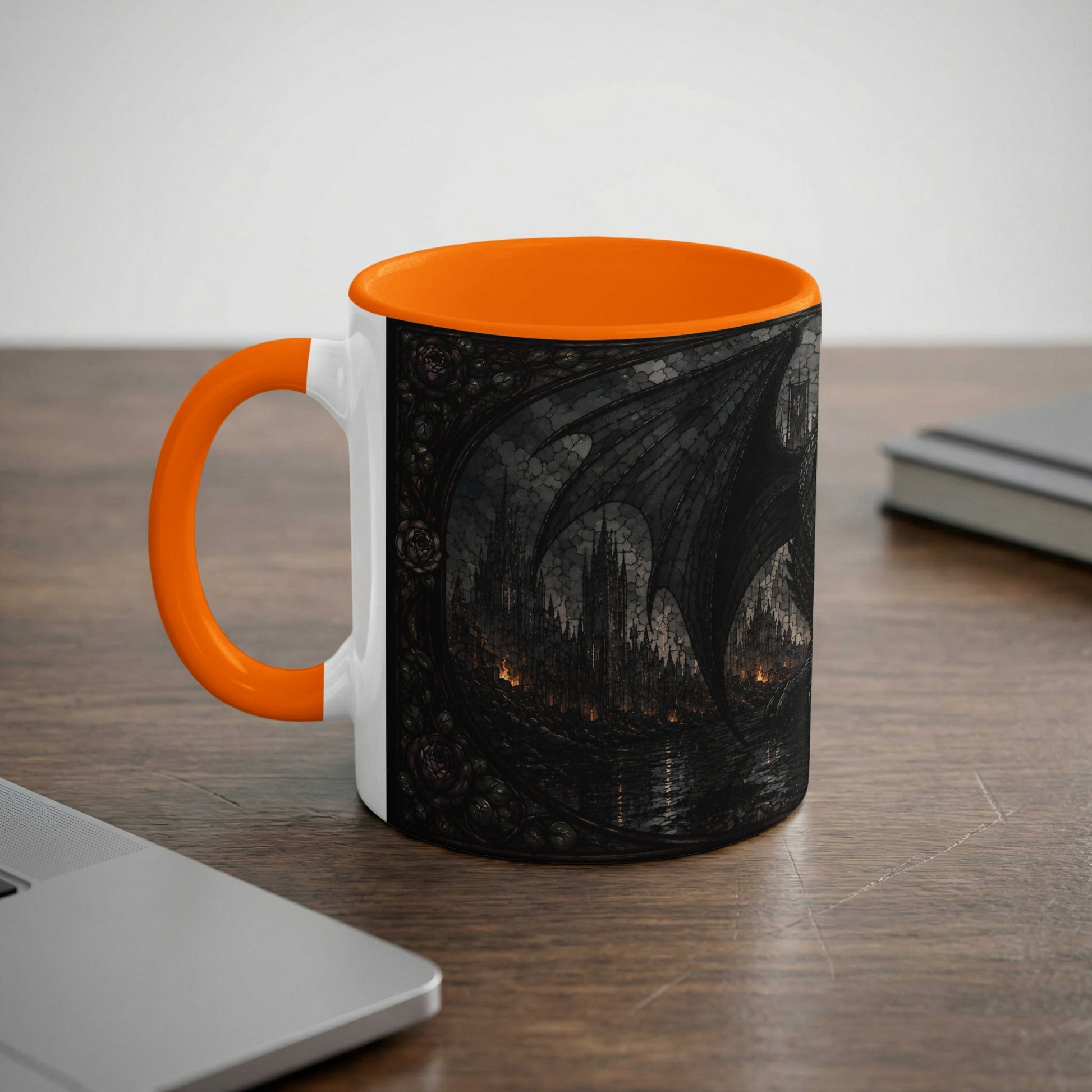 White mug with orange handle featuring a dark fantasy castle and dragon wings design.