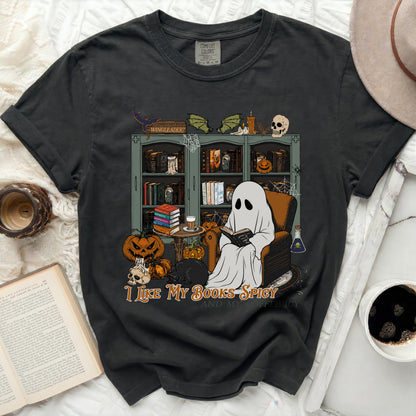 Ghost reading a book with pumpkins, cat, and bookshelf on a t-shirt.