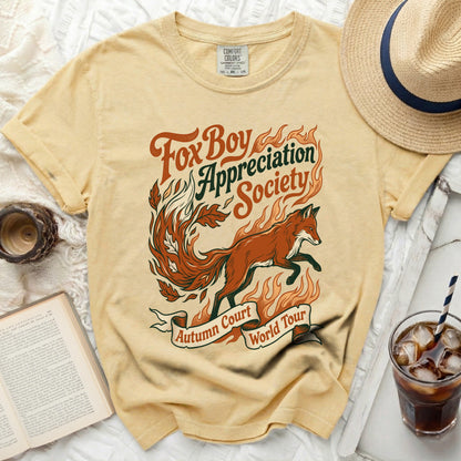 Yellow t-shirt with "Fox Boy Appreciation Society Autumn Court World Tour" graphic.
