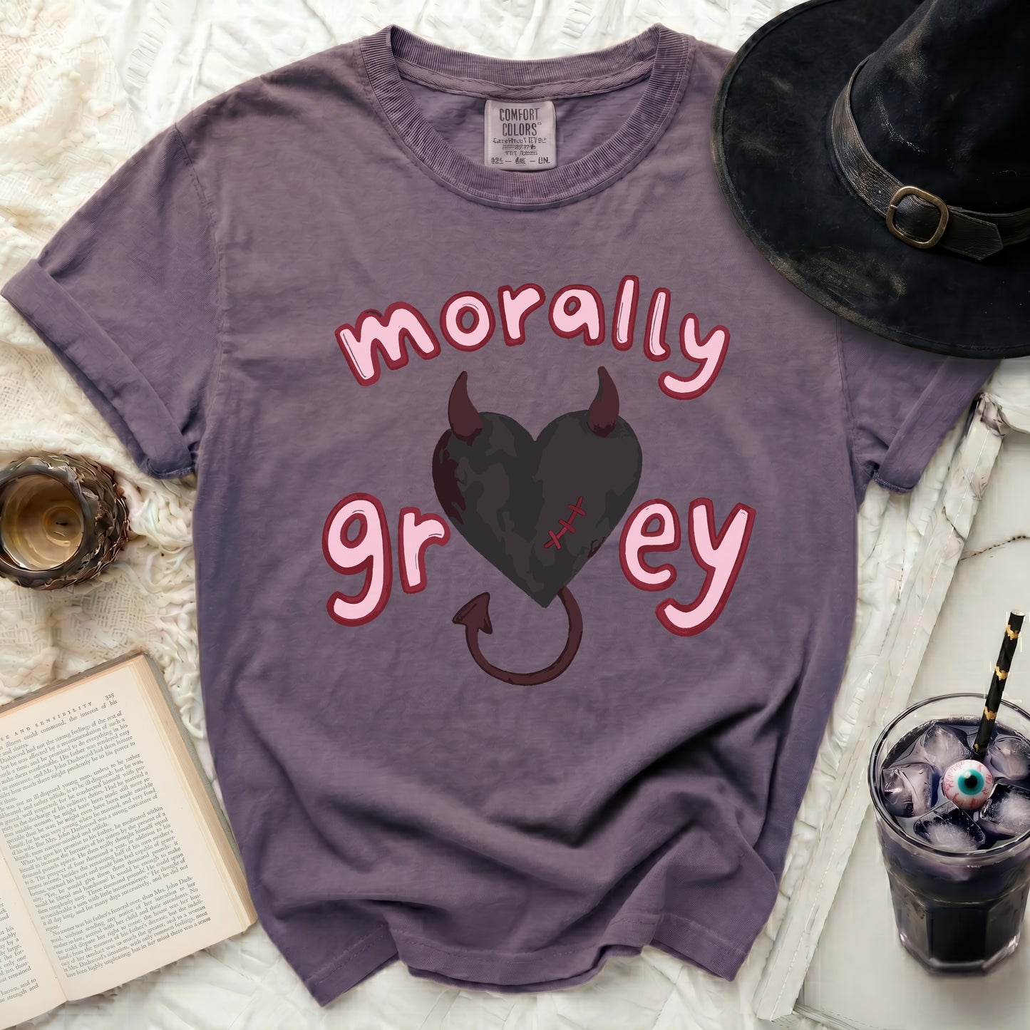 Purple t-shirt with a pink-outlined heart and "morally grey" text.