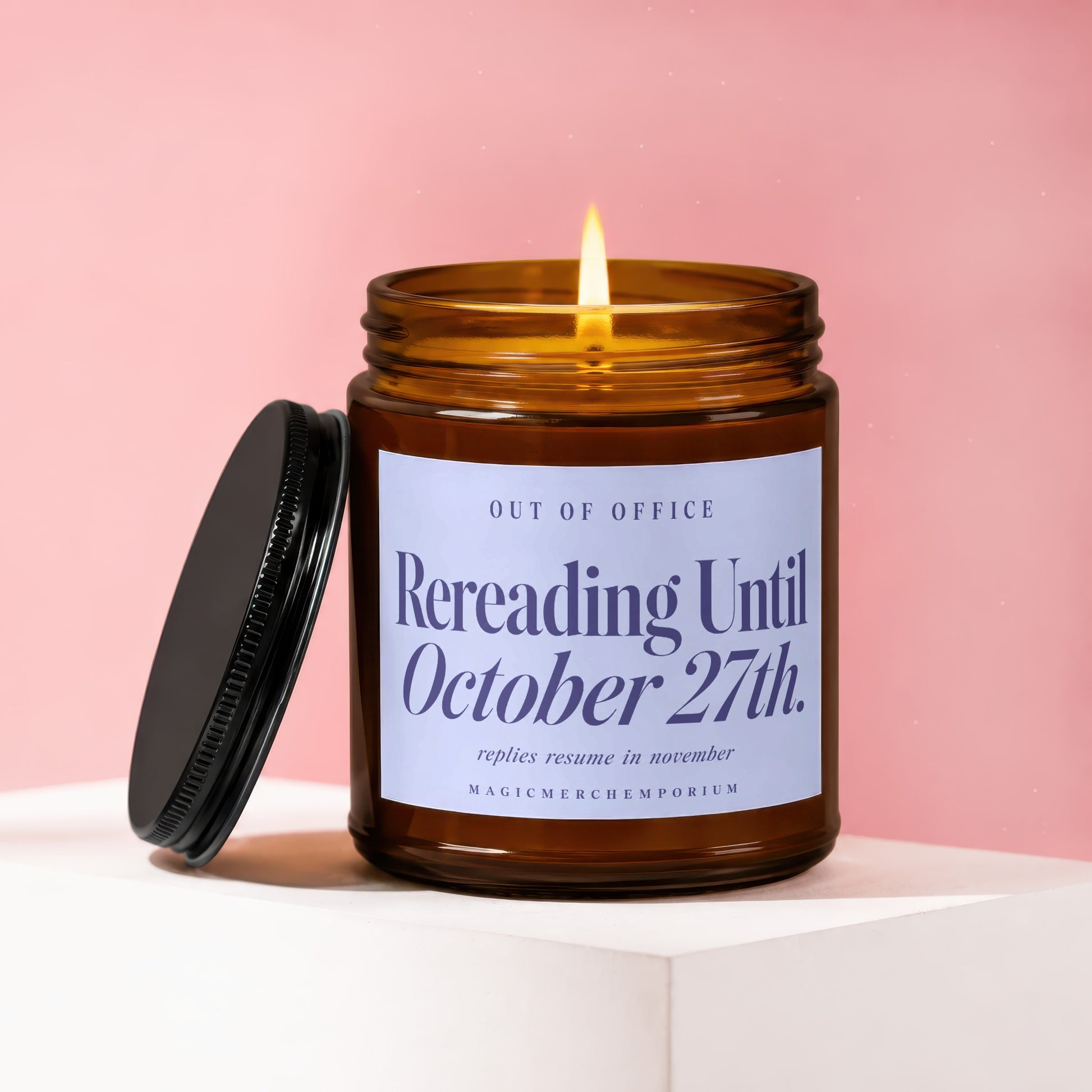 Burning amber candle with text "Rereading Until October 27th."