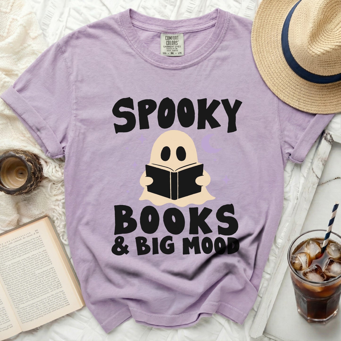 Purple t-shirt with "Spooky Books & Big Mood" text and ghost illustration.
